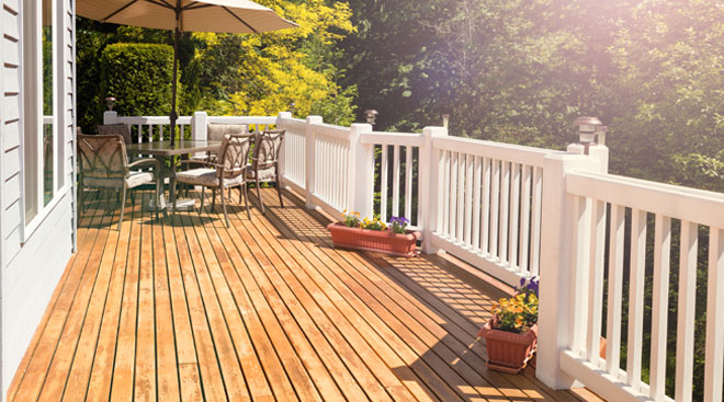 Wood deck with white railings installed in Chicagoland