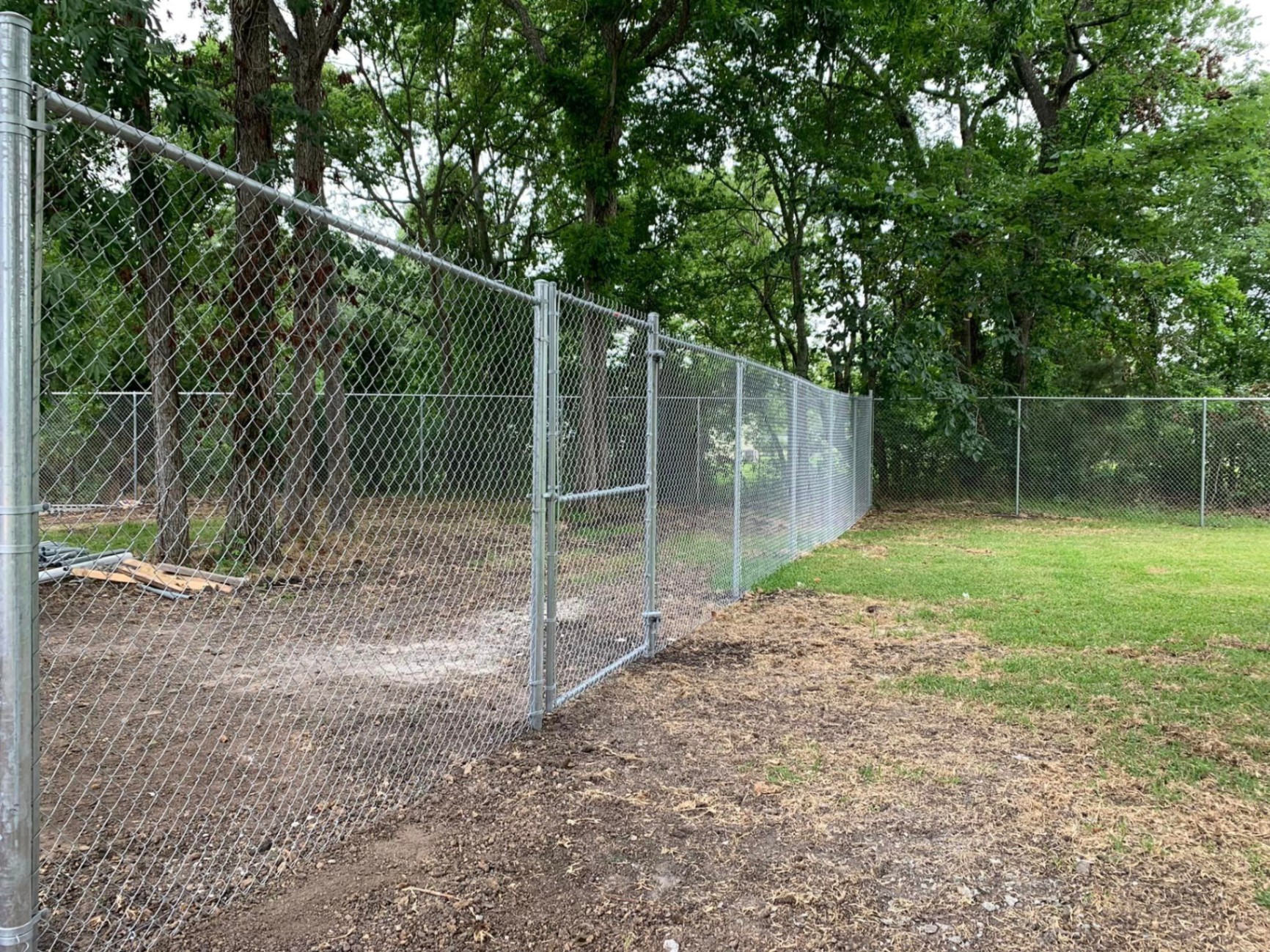 Galvanized chain link fence installed in Romeoville, IL by AmeriDream Fence & Deck