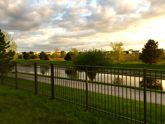 Black aluminum fence installed in Naperville, IL by AmeriDream Fence & Deck