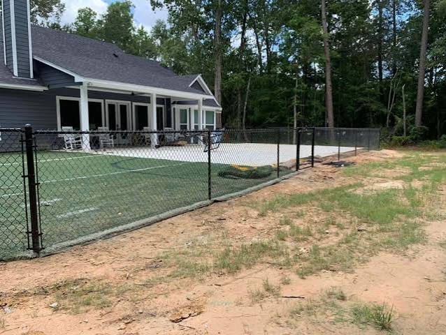 Black Vinyl-Coated Chain Link installed in Crest Hill, IL by AmeriDream Fence & Deck
